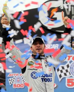 Jimmie Johnson, driver of the No. 48 Lowe's/Kobalt Tools Chevrolet, celebrates in Victory Lane after winning the NASCAR Sprint Cup Series Auto Club 500 at Auto Club Speedway. Credit: Jason Smith/Getty Images for NASCAR